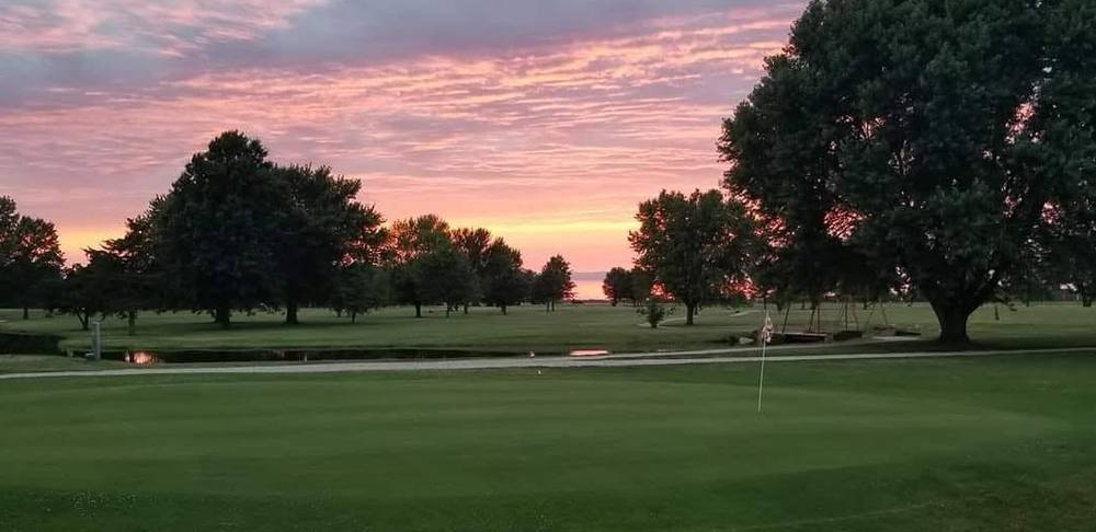 Sunset over the Rock Creek Country Club golf course